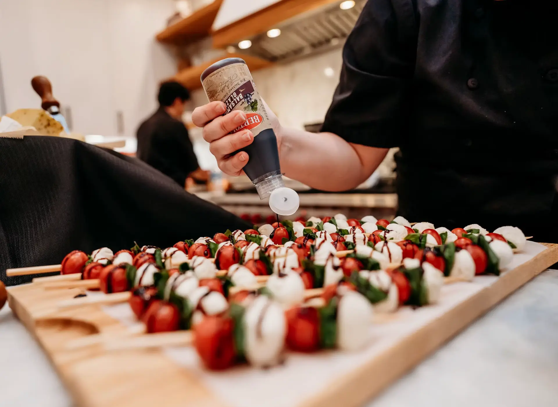 Caprese skewers being plated