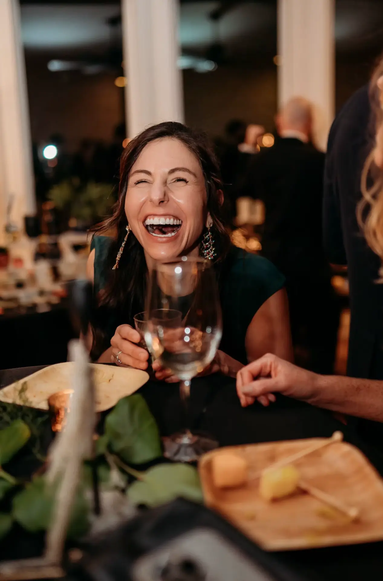 A guest laughing at the table